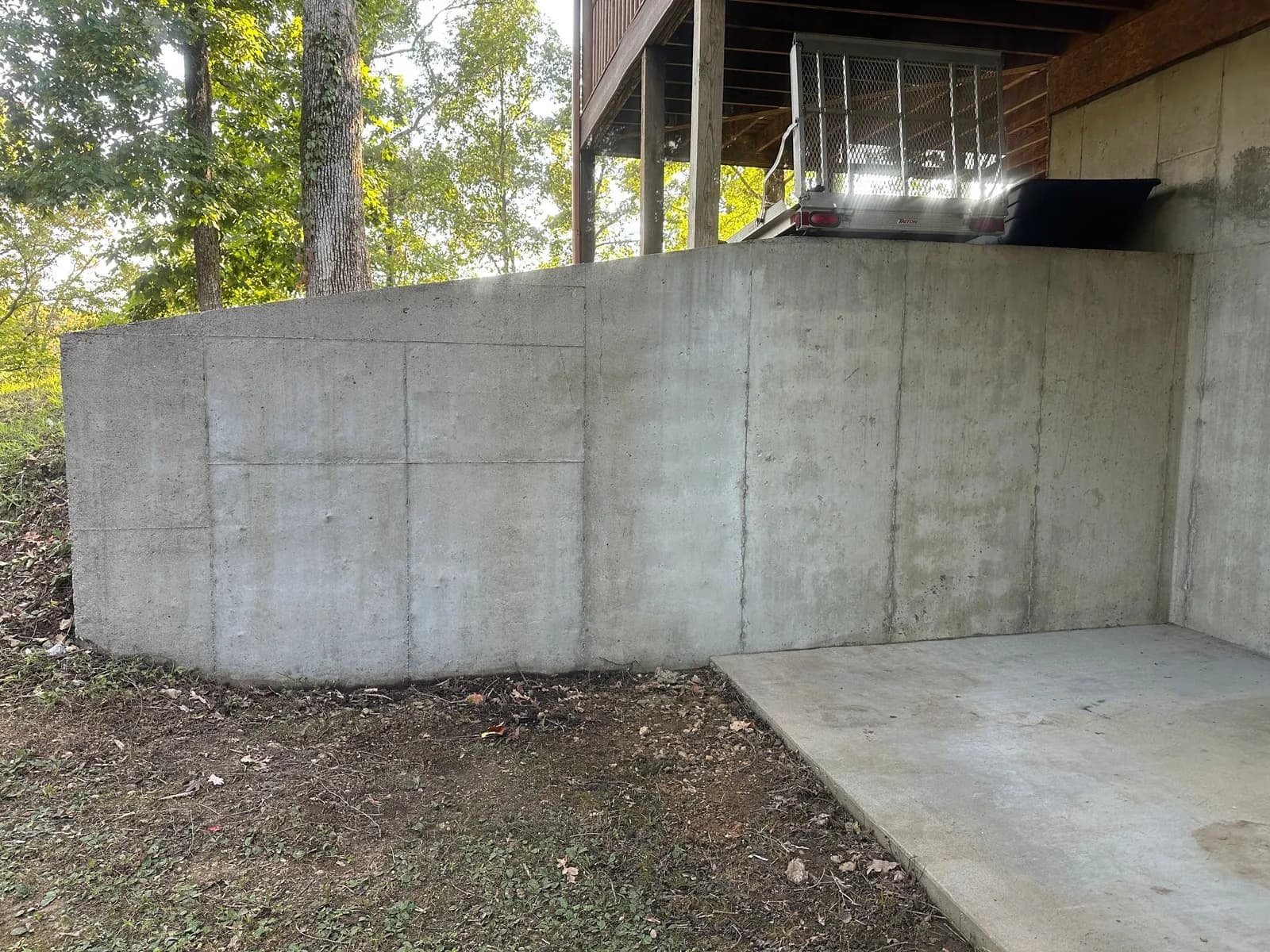 The same retaining wall washed back to bare concrete
