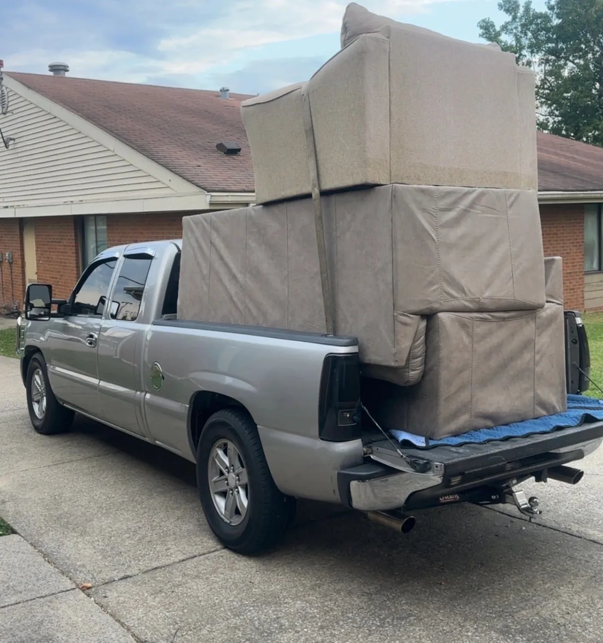 Household move in progress — packed boxes, loaded trailer and cleared rooms (10 of 10)